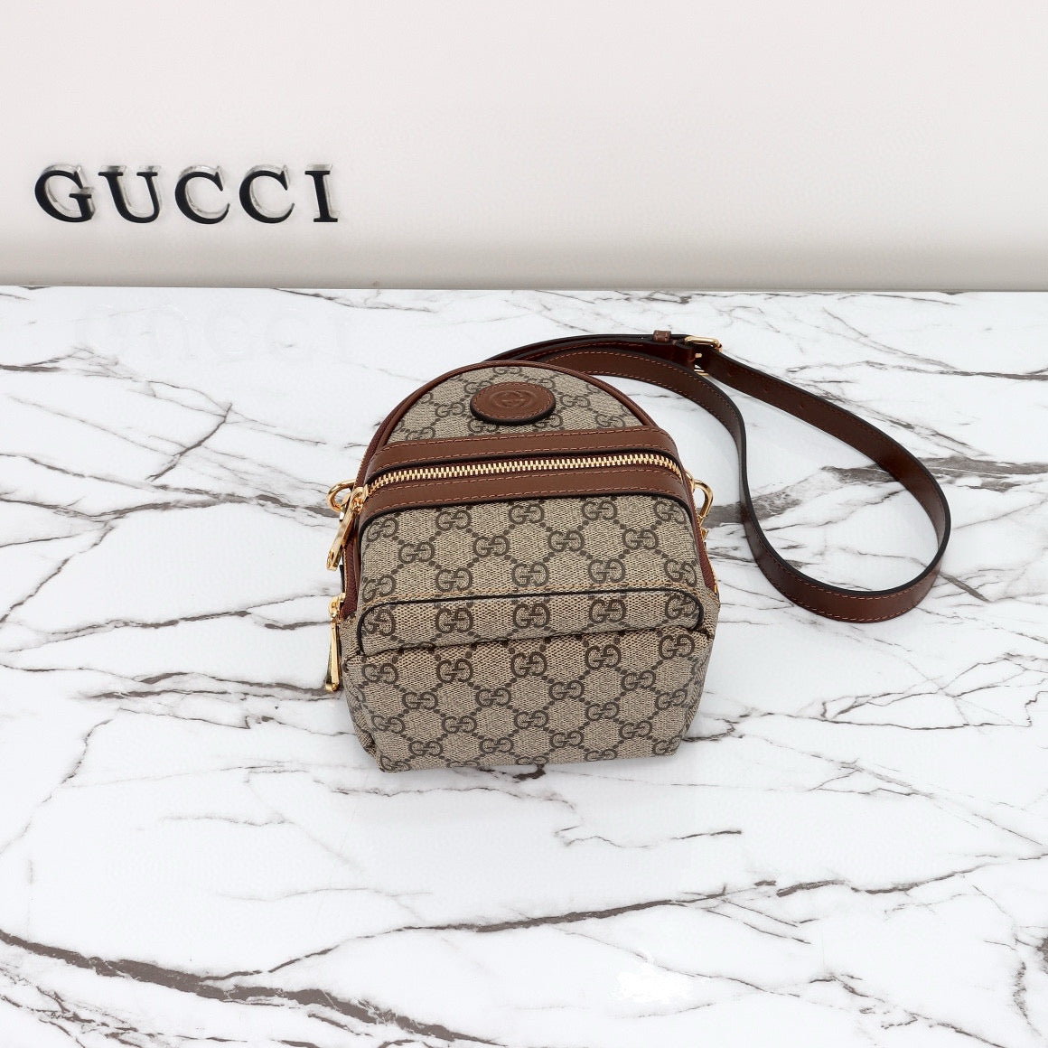 Mini Mochila Gucci Ophidia con Monogram GG y Detalles en Piel Marrón