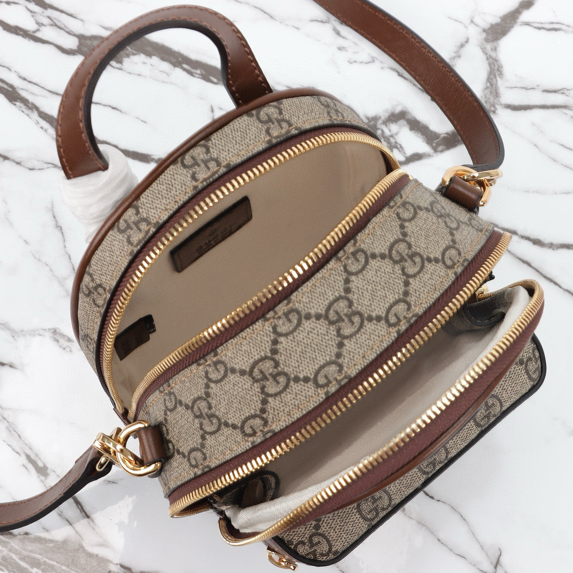 Mini Mochila Gucci Ophidia con Monogram GG y Detalles en Piel Marrón