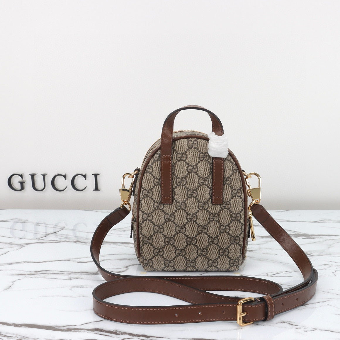 Mini Mochila Gucci Ophidia con Monogram GG y Detalles en Piel Marrón