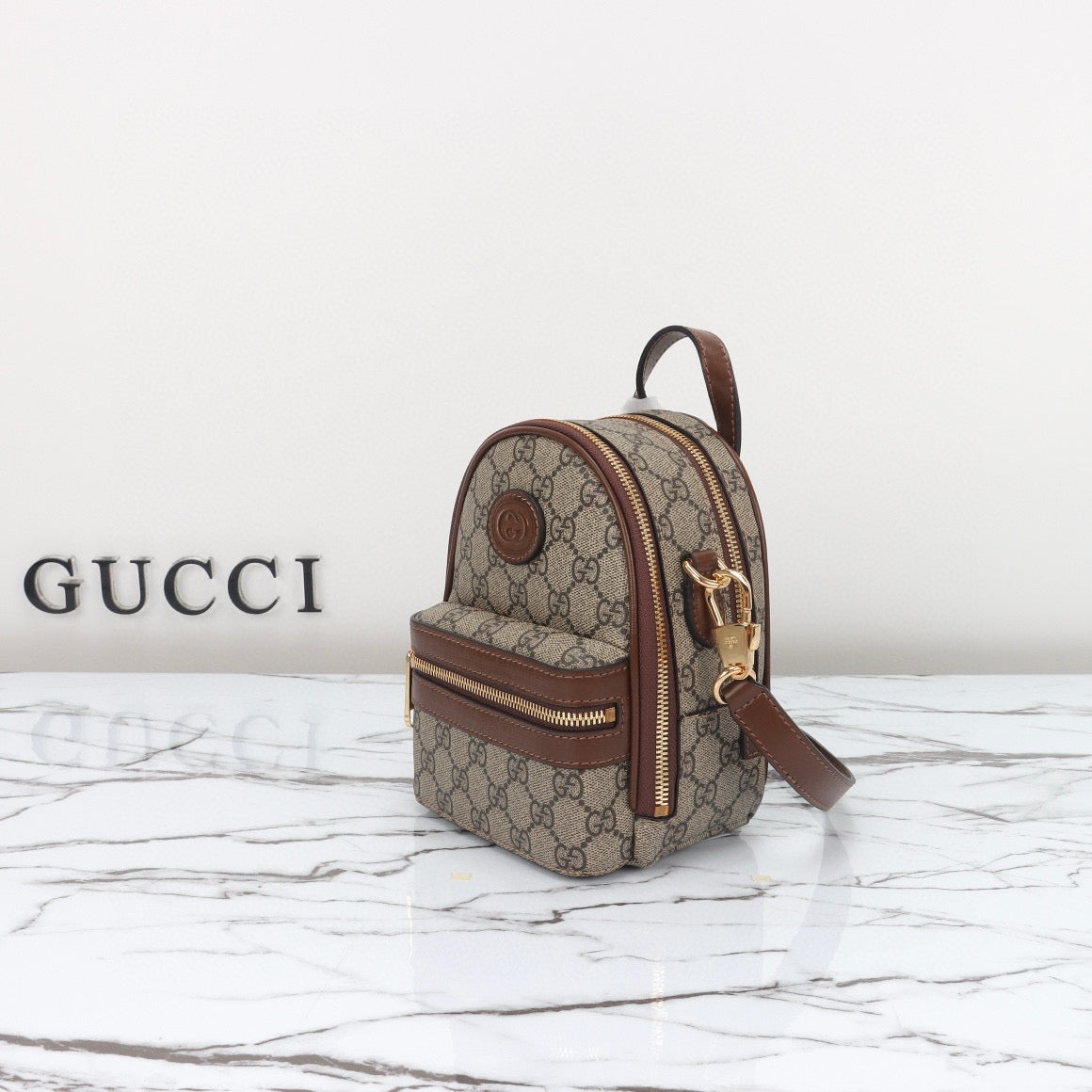 Mini Mochila Gucci Ophidia con Monogram GG y Detalles en Piel Marrón